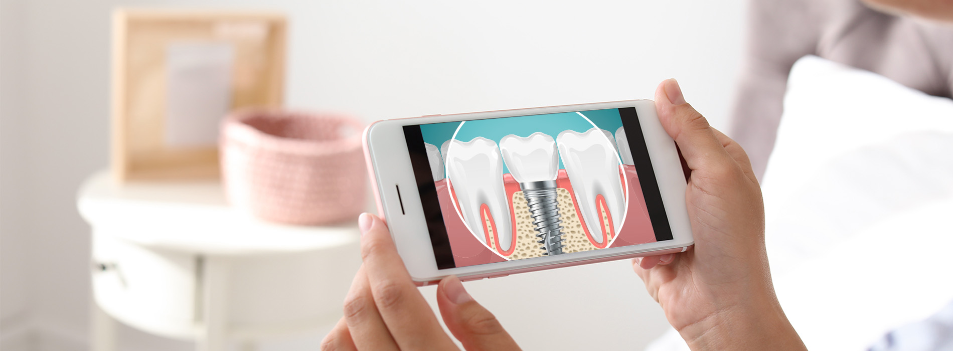 A person holding a smartphone displaying an image of a toothbrush with a split screen showing two different brushing techniques.
