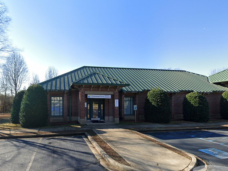 The image shows a building with a green roof and a sign that reads HART on the front, which appears to be a public facility or institution.
